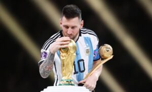 messi with trophy